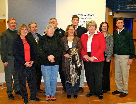 Key people at the PYA dedication included (from left) board of education members Jeff Bray, Anita Maroscher, Mike Van Wormer, Vice President Kathy Guenther, President Jeff Morehouse, Elizabeth Warren and Ryan Hallings; Superintendent Ann Orman, Amanda Thomas and Jim King from King & King Architects.