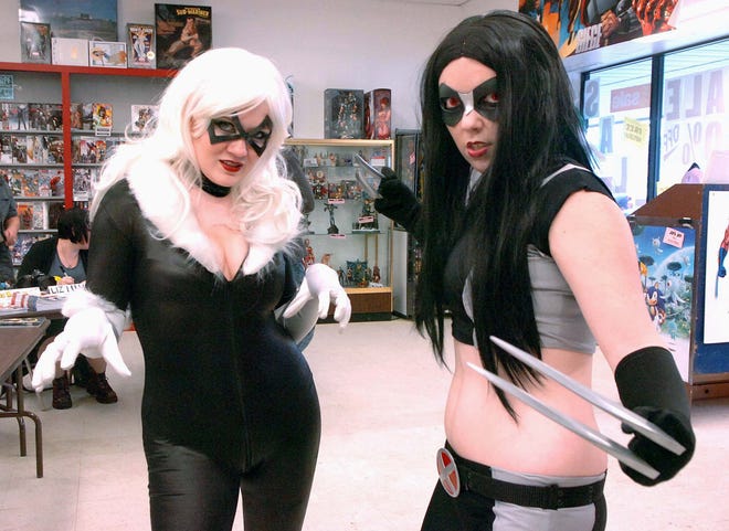 Jessica Jackson, left, who is dressed as the Black Cat from Spider-man, and Martha Bartlett, who is dressed as Wolverine’s female clone from X-23, help kick off New England Comics’ grand reopening in Brockton on Jan. 29