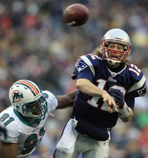 Patriots quarterback Tom Brady throws a pass against the Miami Dolphins last month. Brady was named The Associated Press Offensive Player of the Year on Tuesday, Feb. 1, 2011.