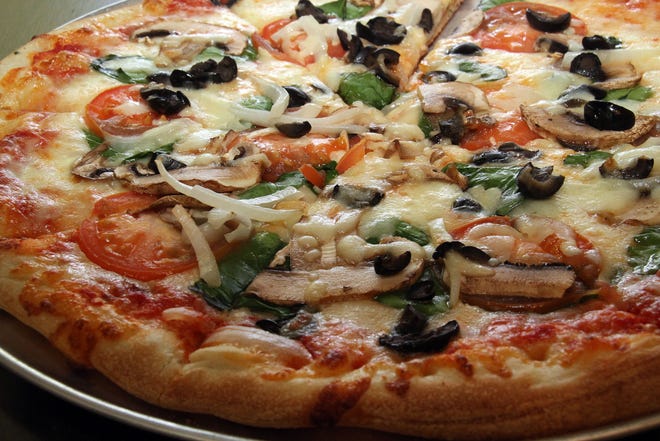Kelly's on Oak Grove Road serves pizzas, subs and barbecue. Shown is a veggie pizza.