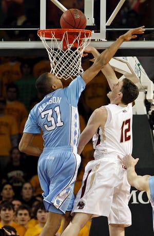Boston College’s Joe Trapani, right, drives to the hoop against North Carolina’s John Henson. Trapani finished with 25 points and 15 rebounds in the game Tuesday, Feb. 1, 2011, in Newton.