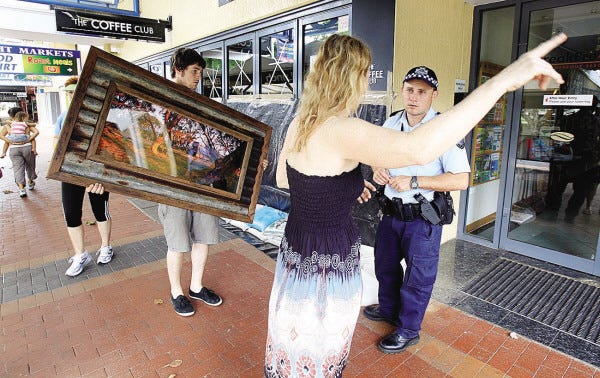 Rick Rycroft/the associated press
A police officer warns people of a mandatory evacuation Wednesday in Cairns, Australia, before Cyclone Yasi struck the coastline early today with winds up to 186 mph.