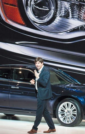 Chrysler Brand CEO Olivier Francois walks in front of a new Chrysler 300 at the recent 2011 North American International Auto Show in Detroit.