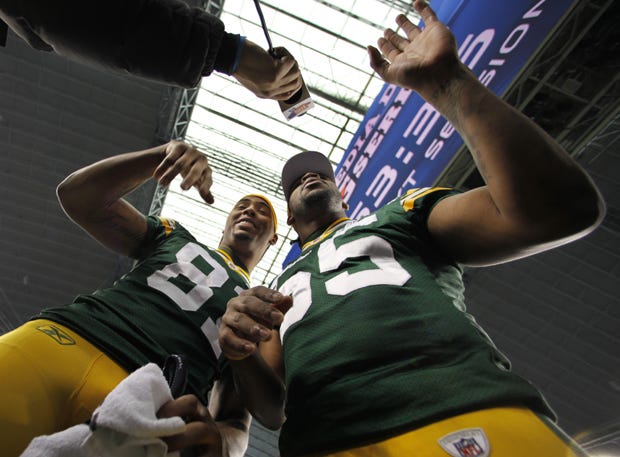 Green Bay Packers' Andrew Quarless and Desmond Bishop (55) have some fun during media day for NFL football Super Bowl XLV Tuesday, Feb. 1, 2011, in Arlington, Texas.