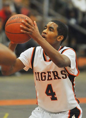Taunton High School's Chris Green eclipsed the 1,000-career point milestone in the Tigers' 59-57 loss to Barnstable on Friday night. Green scored a game-high 26 points in the loss.