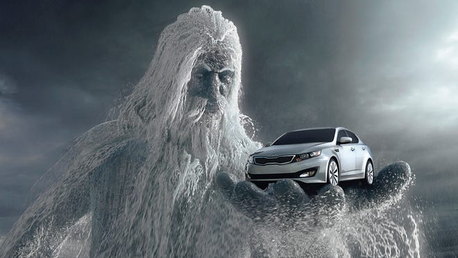 This screen shot provided by Kia Motors Corp., shows a scene from the Super Bowl commercial titled "One Epic Ride," with the all-new 2011 Kia Optima being held by Poseidon.