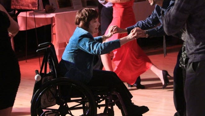 Beyond Blind Institute's Dancing Out of Darkness fund raiser at Fred Astaire Dance Studios in West Palm Beach Friday night. Blind women are paired with dance instructors to show what they've learned. Paula Cellar of Boynton Beach dances with instructor Andres Florez(cq). Cellar is blind and has cerebral palsy. "I like to emphasis what I can do," Cellar said. She lives independently and has a career and volunteers. She also has a master's degree.