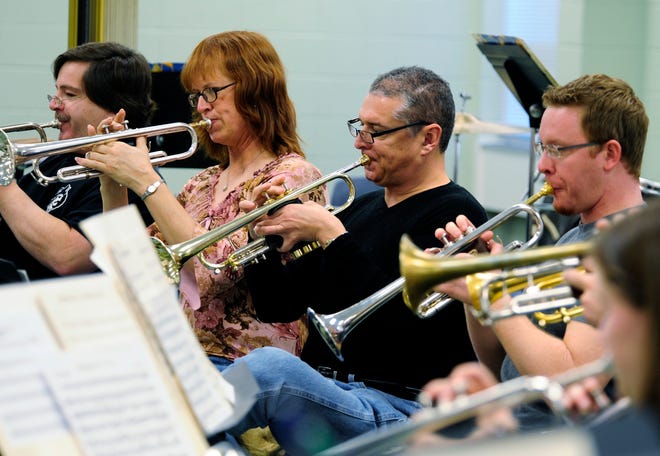 Members of the Savannah River Winds rehearse for an upcoming performance. The wind ensemble was selected for a national award in December and will receive the John Philip Sousa Foundation's Sudler Silver Scroll at their next concert.