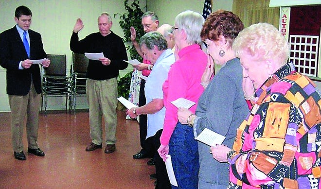 County Commissioner Mark Miner administers the oath of office to the officials of the St. Augustine South Improvement Association. Contributed photo