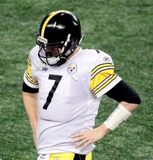 Pittsburgh Steelers quarterback Ben Roethlisberger walks off the field at the end of Super Bowl XLV against the Green Bay Packers. The Associated Press