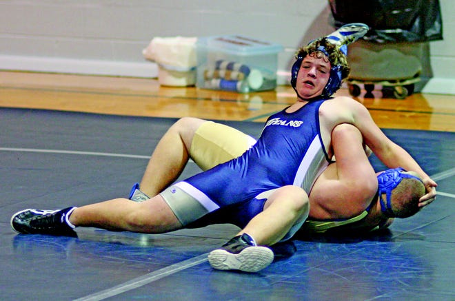 Tanner Edwards fights to get a pin in 2009.
