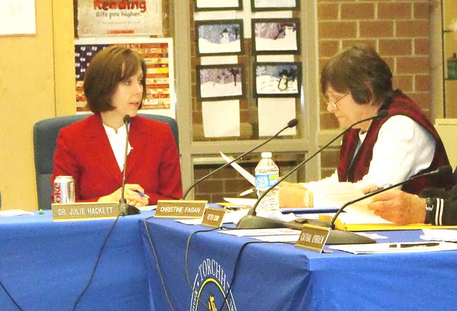 Superintendent Julie Hackett, left, and School Committee member Christine Fagan discuss the options to make up snow days.