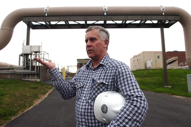 David Norton explains the process at the Brockton wastewater treatment plant last April.