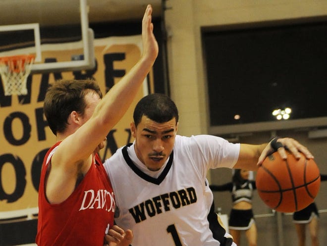 Davidson's JP Kuhlman (1) guards Wofford's Cameron Rundles (1) on the way to the basket Wednesday night at Wofford.