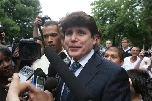Former Gov. Rod Blagojevich talks to the media outside of his home on the north side of Chicago after being convicted on one of 24 counts in his federal corruption trial on Tuesday Aug. 17, 2010. (AP Photo/Eric Y. Exit)