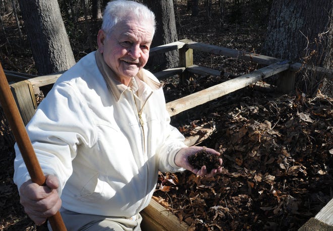 Master gardener Joe Maple works in his compost piles in his garden. He calls his compost “brown gold,” and uses it in vegetable gardening.
