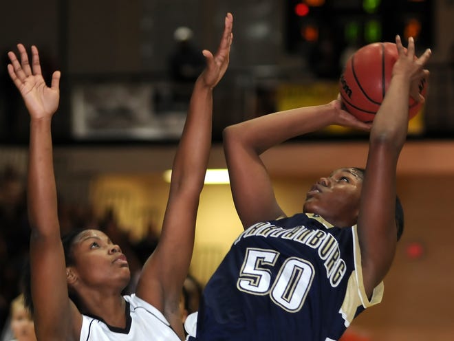 Spartanburg’s Lee Lee Young (50) goes up for a shot against Gaffney’s Ashlee Tate (21) on Friday.