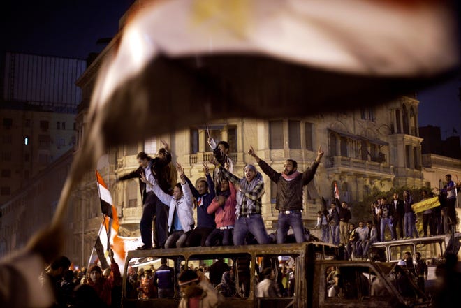 Anti-government protesters celebrate in Tahrir Square in Cairo, Egypt , Egypt Friday, Feb. 11, 2011, following the announcement of the resignation of Egyptian President Mukarak.