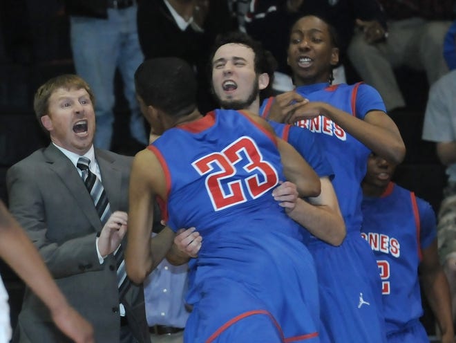 Byrnes head coach Layne Fowler, left reacts to his team beating Gaffney, 61-54, in overtime in the first round of the 4A playoffs on Wednesday night in Gaffney.