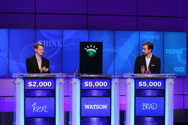 In this undated publicity image released by Jeopardy Productions, Inc., contestants Ken Jennings, left, and Brad Rutter and a computer named Watson compete on the game show "Jeopardy!" in Yorktown Heights, N.Y. (AP Photo/Jeopardy Productions, Inc., Carol Kaelson )