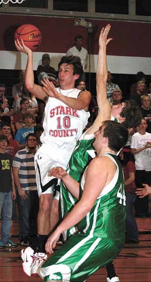 Jon Rediger (10) takes it to the bucket for Stark County Tuesday night.