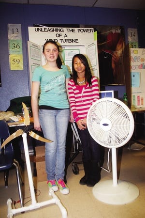TESTING WIND: Hannah Sipe (left) and Corrin Courville did their science fair project on using wind turbines for electricity, which has been a frequent topic in the news in recent years.