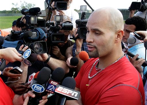 St. Louis Cardinals slugger Albert Pujols speaks to the media after arriving in camp for spring training baseball Thursday, Feb. 17, 2011, in Jupiter, Fla. The deadline for Pujols and the St. Louis Cardinals to reach a new contract agreement passed Wednesday with no new deal, making it likely the three-time MVP will test the free-agent market after the season. (AP Photo/Jeff Roberson)