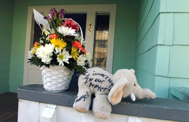 A makeshift memorial is being formed at 427 Warren Ave. in Brockton for murder victims Maria Avelina Palaguachi-Cela and her 2-year-old son, Brian.