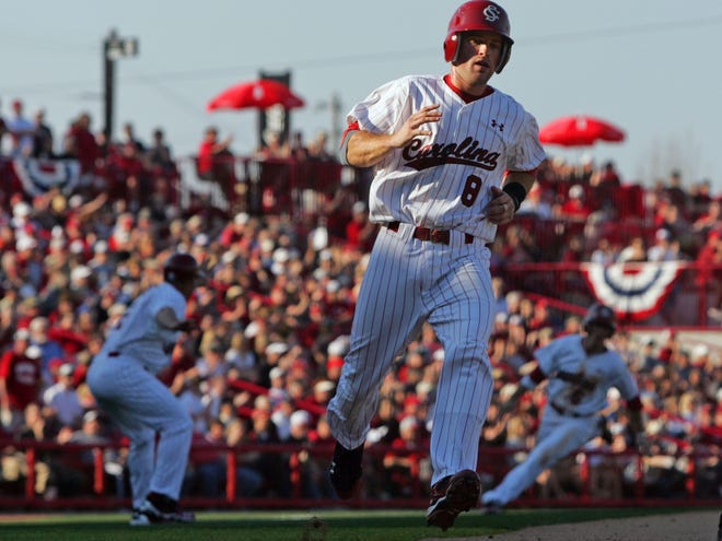 South Carolina's Scott Wingo scores the Gamecocks' first run off a Jackie Bradley Jr. hit during the third inning against Santa Clara during opening day Friday at Carolina Stadium in Columbia.