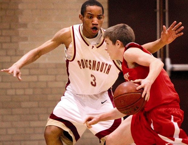 Ioanna Raptis/Portsmouth Herald photo
Portsmouthl's Kamahl Walker, left, defends Coe-Brown's Tom Darling during Friday's Division II game in Portsmouth.