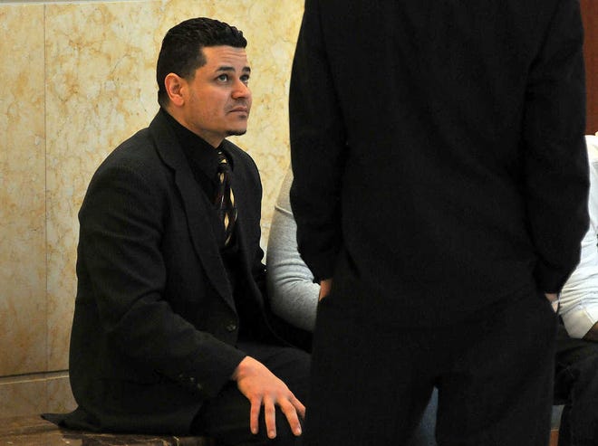 The Rev. Angel Morales waits outside Worcester Superior Court for the jury to return in his trial on child rape charges.
