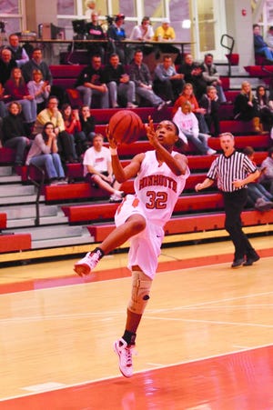 Zipporah Williams lays in two of her game-high 26 points against Knox College Tuesday night.