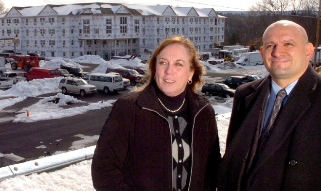 Susan Mikels, commercial real estate specialist, left, and Spiros Bilianis, broker/owner for Coldwell Banker Pennco Commercial Real Estate in Stroudsburg, stand outside of the site of a large senior housing project being built along Route 611 in Stroud Township on Tuesday. The two feel that there is still room for commercial growth along the Route 611 corridor.   To purchase a reprint of this photo, go to  www.PoconoRecord.com/photostore.