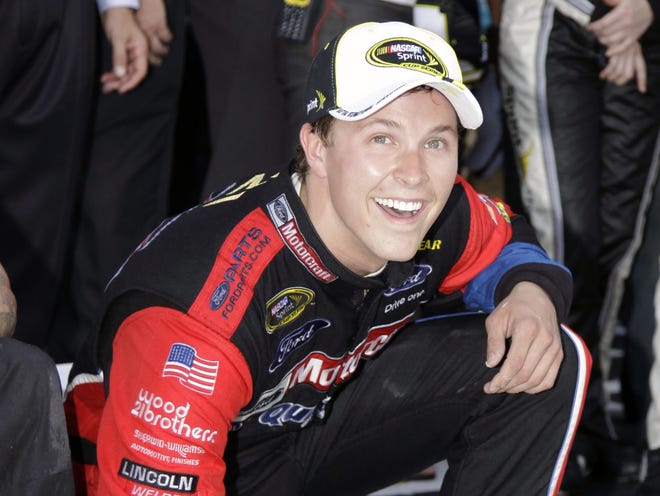 Trevor Bayne smiles after writing his name in concrete after winning the Daytona 500 on Sunday in Daytona Beach, Fla.