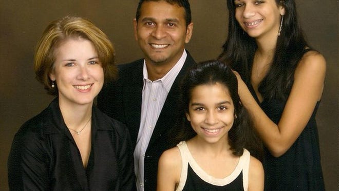 Jay Boodheshwar, center, with his wife Anne, left, and daughters Haley, 13, right, and Miranda, 10, front.