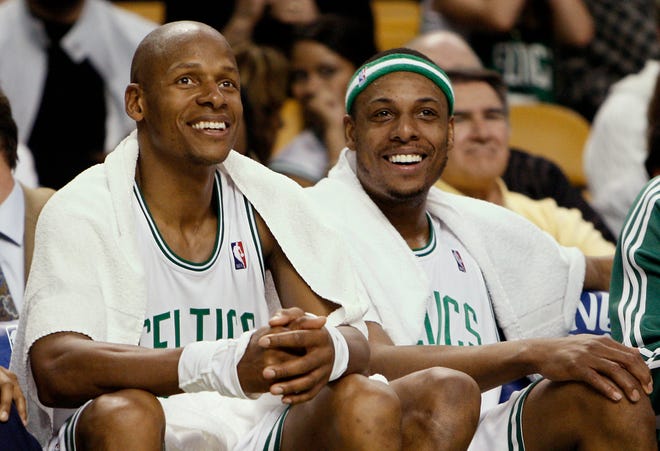 FILE - In this May 6, 2009, file photo, Boston Celtics' Ray Allen, left, and Paul Pierce smile on the bench during the fourth quarter of Bostons' 112-94 win over the Orlando Magic in Game 2 of an NBA basketball Eastern Conference semifinal series in Boston. The Celtics will have two representatives in Saturday night's, Feb. 19, 2011, 3-point contest and, soon, two members of the NBA's career top 10 in 3-pointers. Allen, who is No. 1 all-time after breaking Reggie Miller's record last week, is the pensive and methodical one; Pierce is the trash-talking playmaker who's already letting Allen know: It's on. (AP Photo/Winslow Townson, File)
