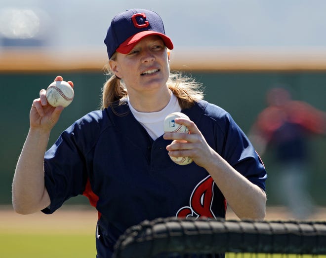 Justine Siegal throws batting practice to Cleveland Indians catchers during spring training Monday in Goodyear, Ariz. Siegal became the first woman to pitch batting practice at a Major League camp.