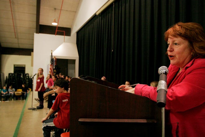 Georgetown Public School Superintendent Carol Jacobs reads off a word during the Penn Brook Elementary School Spelling Bee on Tuesday night, Feb. 23.