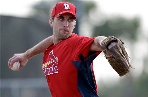 In this Feb. 26, 2011 file photo, St. Louis Cardinals starting pitcher Adam Wainwright throws during spring training baseball in Jupiter, Fla. Wainwright has injured his throwing elbow and is returning to St. Louis to have it examined by team doctors. General manager John Mozeliak said Wednesday, Feb. 23, 2011, that "things do not look encouraging" for the 2010 Cy Young runner-up based on the initial evaluation by training staff.