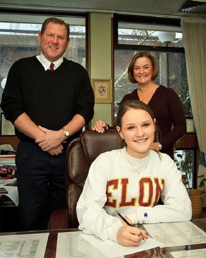 Belmont High senior Marissa Russo, with parents Jim and Judy Russo, signs her national letter of intent to play college soccer at Elon University.