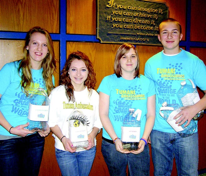 Tumani Ambassadors members challenged their classmates to excel in donating money for worthy causes. Jugs have now been placed throughout the school for spare change. Asking each grade to outdo the other were, from left, Hannah Lougheed, sophomore; Caitlyn Bowling, freshman; Courtney Wagner, senior; and Caleb Bartlett, junior.