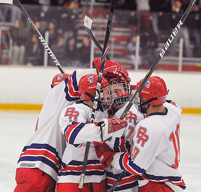 Members of the Bridgewater-Raynham hockey team celebrate Pat McNamara's goal during the second period of Wednesday's semifinal game of the South of Boston Shootout at Bridgewater Ice Arena.