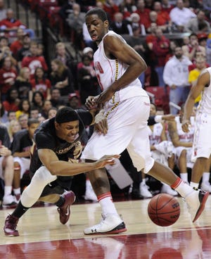 Florida State forward Terrance Shannon (left) goes for a loose ball against Maryland forward Dino Gregory on Wednesday night.