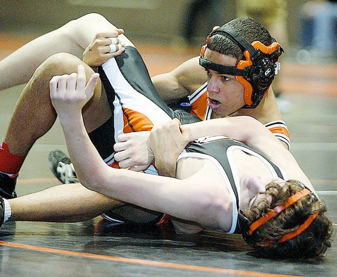 Massillon's Ivan McClay has control of Green's Mickey Munsey in their matchup at the Divison I sectionals held at Hoover High.