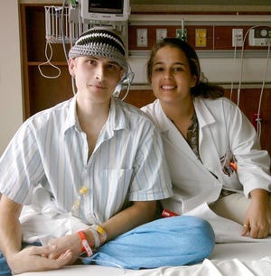 Jhaysonn Pathak, with one of his doctors, Leyaini Cabezas, received a stem-cell transplant.