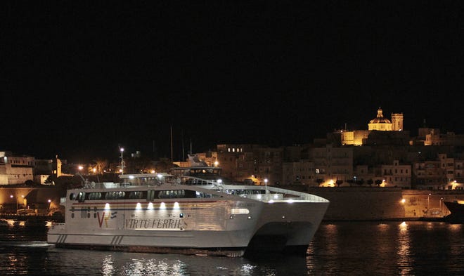 A ferry carrying Americans and other foreigners arrives at the harbor in Valletta, Malta, Friday, Feb. 25, 2011. The Maria Dolores ferry left Tripoli's As-shahab port on an eight-hour trip to Valetta. Its passengers, at least 167 U.S. citizens and 118 other foreigners, have been aboard the catamaran since Wednesday in their quest to escape Libya's escalating turmoil, but rough seas prevented the ferry from leaving. (AP Photo/Gregorio Borgia)