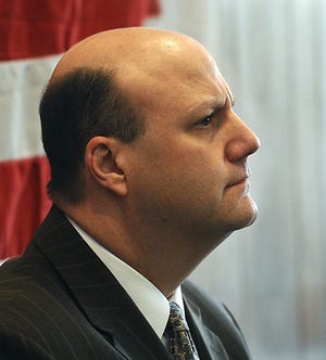 Robert Diduca, 46, of Milford, sits in Milford District Court after his pretrial conference was continued Thursday. Diduca is facing two counts of possession of child pornography and one count of dissemination of child pornography after investigators said they found 10,000 images of young children on a computer.