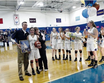 Photo by Daniel Freel/New Jersey Herald 
 
Pope John’s Lexi Breheny, second from left, poses with her father and mother, Paul and Brenda, after scoring her 1,000th career point during a game against River Dell on Thursday in Sparta.