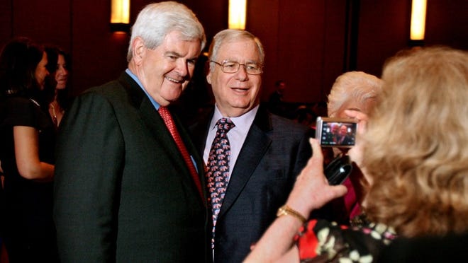 Former House Speaker Newt Gingrich poses for a photo with Larry Bishins of Delray Beach at the Kravis Center on Thursday.