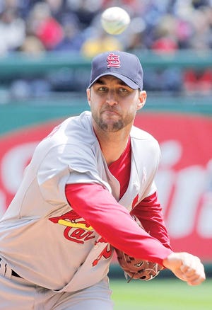 In this May 9, 20110, photo, St. Louis Cardinals pitcher Adam Wainwright throws to the Pittsburgh Pirates during a baseball game in Pittsburgh. Wainwright will have Tommy John surgery on his right elbow and miss the entire season. Cardinals general manager John Mozeliak confirmed the news Thursday, Feb. 24, 2011, from spring training camp. (AP Photo/Gene J. Puskar)